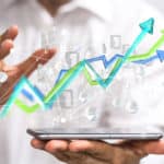 Man holding tablet with line graph; Monetize Your Video Content